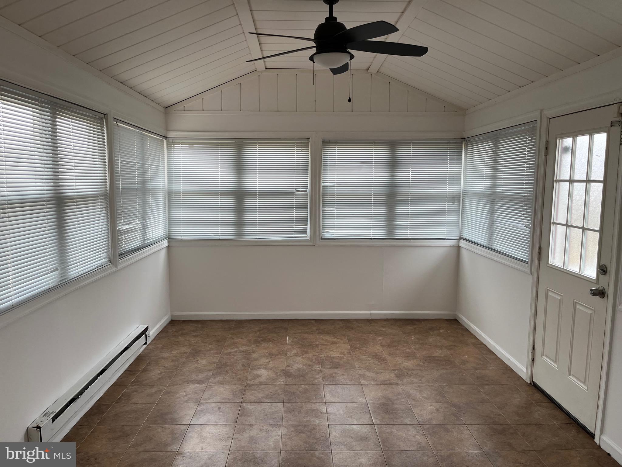 8829 Sigrid Road Randallstown, MD 21133 - Photo 5 of 28 en empty room with windows