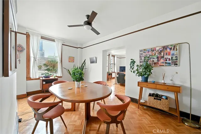 a dining room with furniture and window
