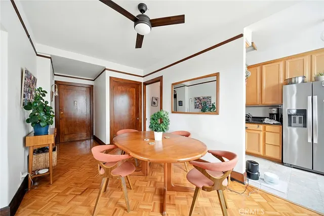 a kitchen with stainless steel appliances granite countertop a refrigerator a stove and a sink