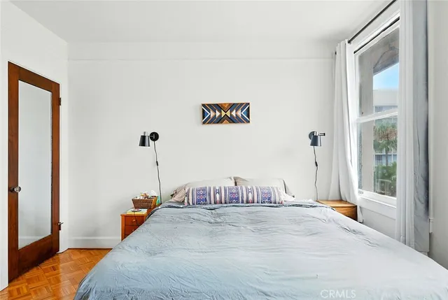 a bathroom with a sink mirror and toilet