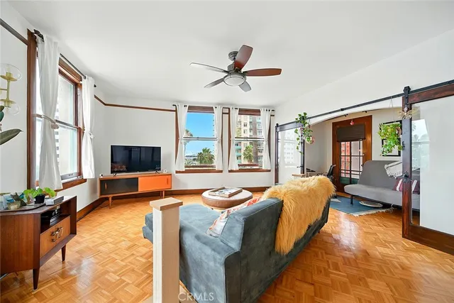 a living room with furniture and a window