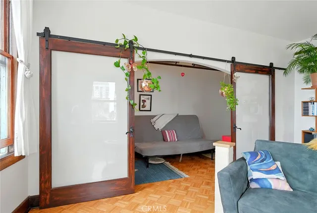 a bedroom with furniture and a window