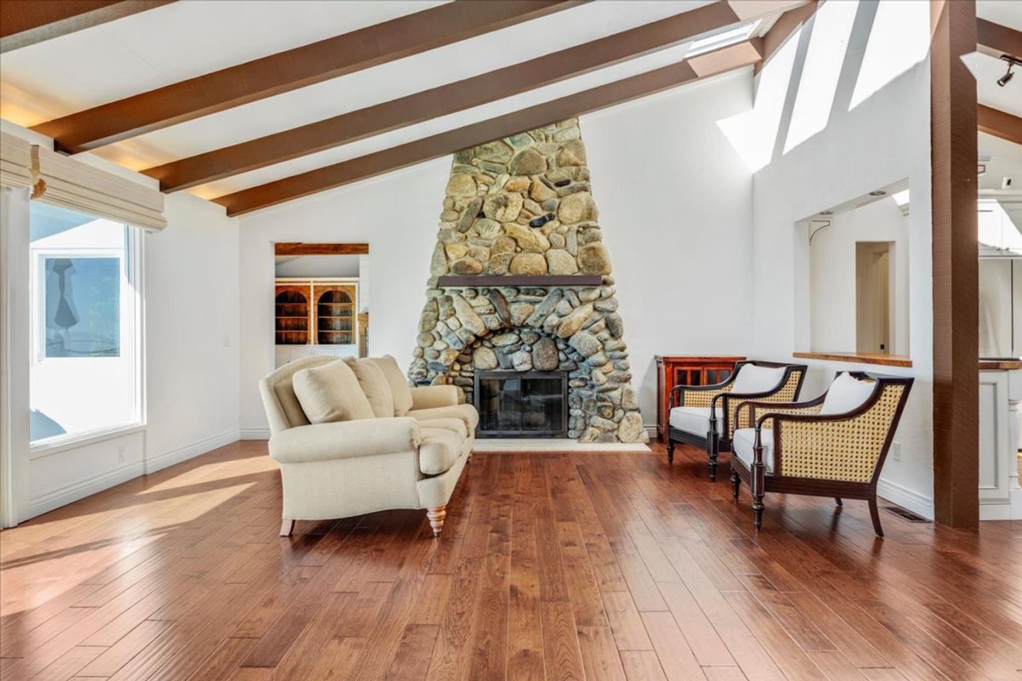 15 Mentone Road Carmel, CA 93923 - Photo 10 of 47 a living room with furniture and a fireplace