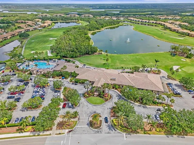 an aerial view of a residential houses with outdoor space