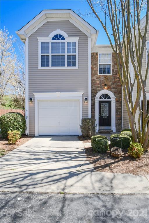 1903 Travertine Lane Fort Mill, SC 29708 - Photo 1 of 20 a front view of a house with garden