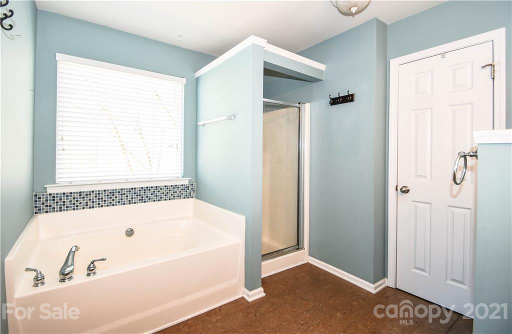 1903 Travertine Lane Fort Mill, SC 29708 - Photo 16 of 20 a bathroom with a bathtub and a shower