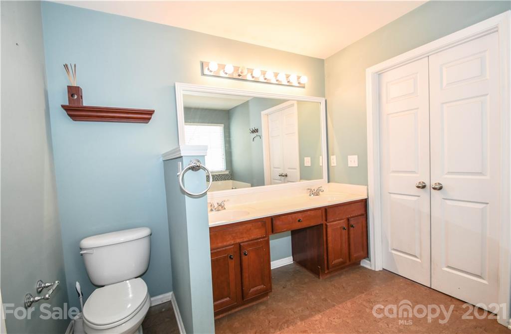 1903 Travertine Lane Fort Mill, SC 29708 - Photo 17 of 20 a spacious bathroom with a toilet sink and mirror