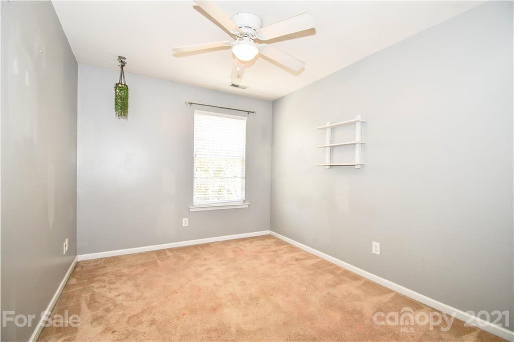 1903 Travertine Lane Fort Mill, SC 29708 - Photo 18 of 20 an empty room with windows and fan