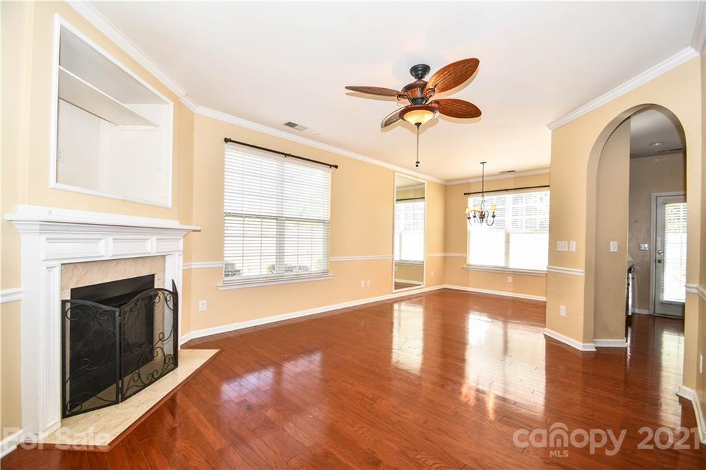 1903 Travertine Lane Fort Mill, SC 29708 - Photo 4 of 20 a view of an empty room with window and wooden floor