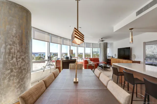 a kitchen with stainless steel appliances granite countertop a sink a stove and a wooden floors