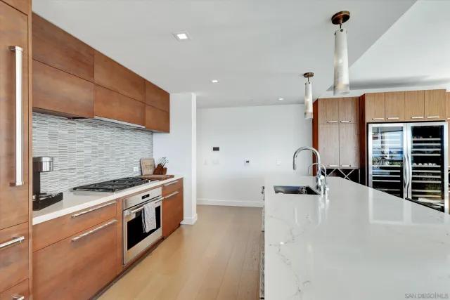a bedroom with a large bed and a large window
