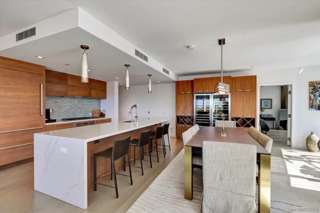 a kitchen with stainless steel appliances kitchen island granite countertop a sink and cabinets