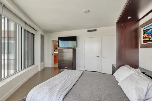 a building outdoor space with patio furniture and potted plants