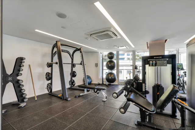 a dining room with a wooden table and chairs