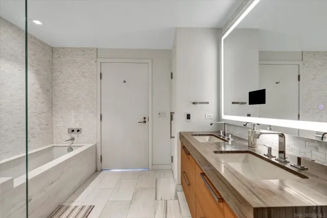 a living room with furniture fireplace and a chandelier