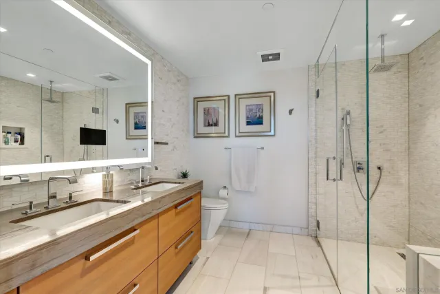a dining room with stainless steel appliances a table and chairs