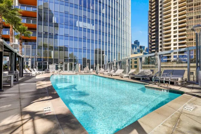 a view of swimming pool with outdoor seating