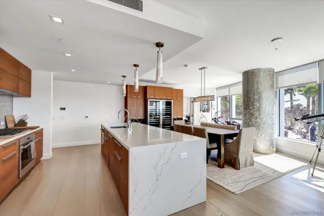 a kitchen with sink stove and refrigerator