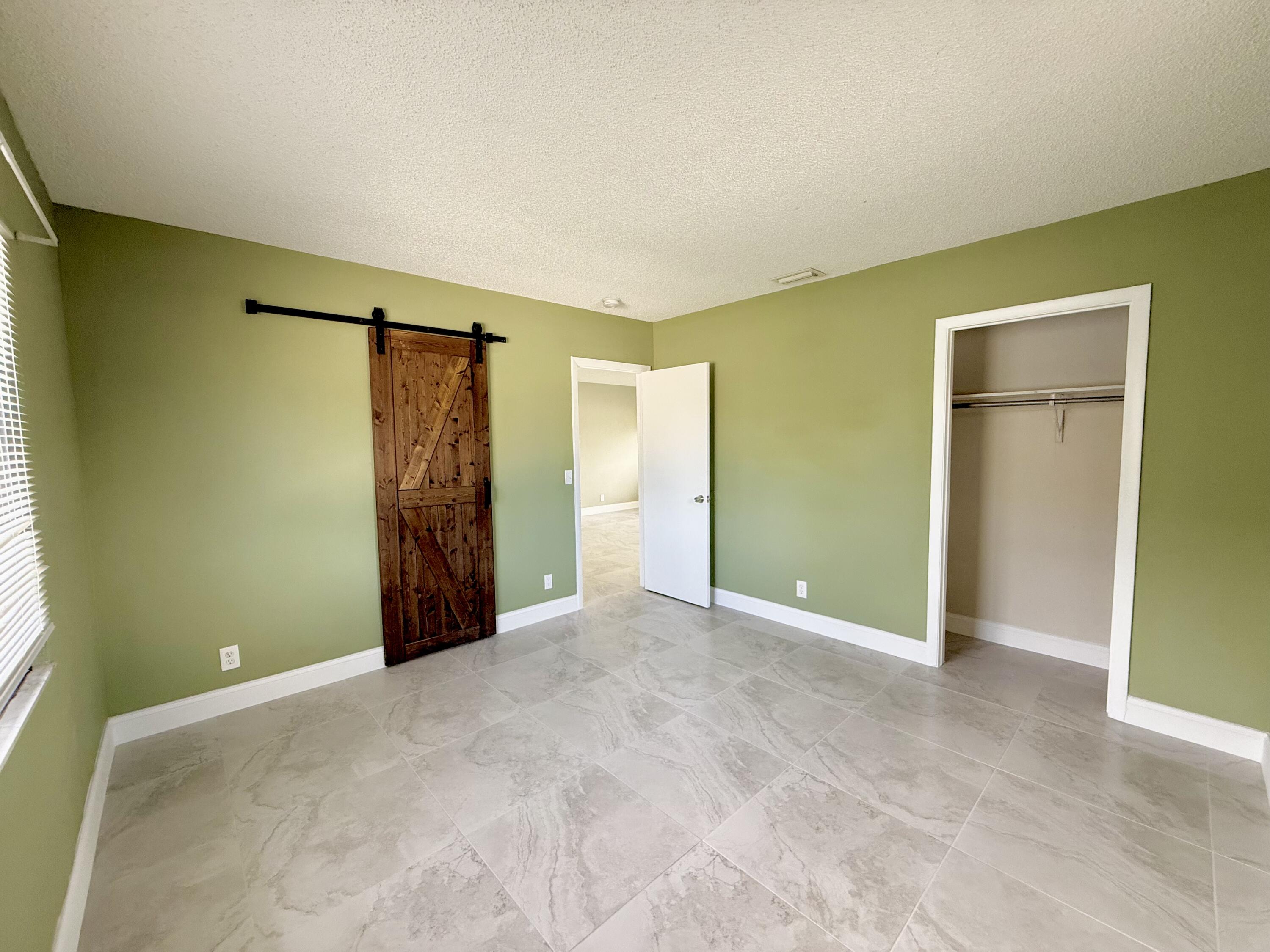 1691 West 26th Street, Unit 1 Riviera Beach, FL 33404 - Photo 5 of 6 Primary Bedroom