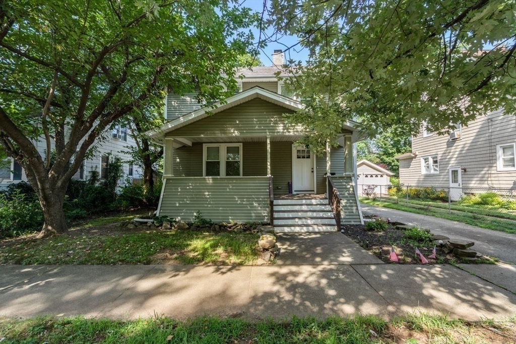 38 Manchester Terrace Springfield, MA 01108 - Photo 1 of 15 a view of a house with a yard and large tree