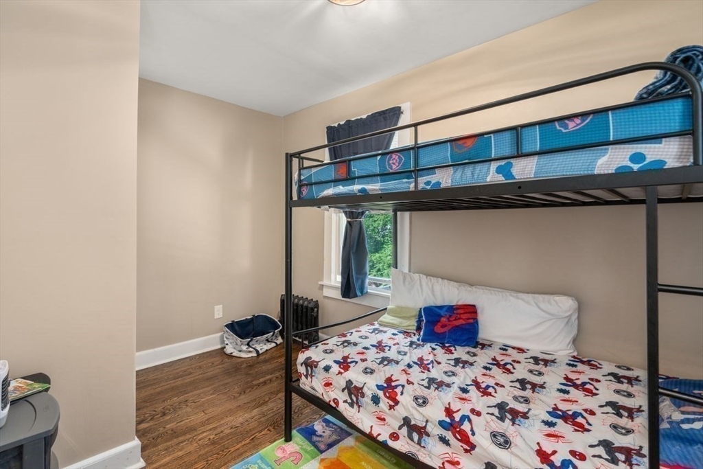 38 Manchester Terrace Springfield, MA 01108 - Photo 12 of 15 a bedroom with a bed and a dresser