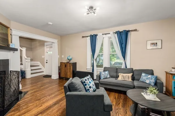 a living room with furniture and a large window