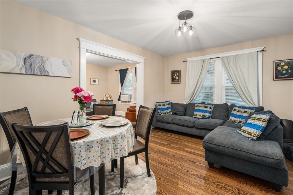 38 Manchester Terrace Springfield, MA 01108 - Photo 6 of 15 a living room with furniture and a chandelier