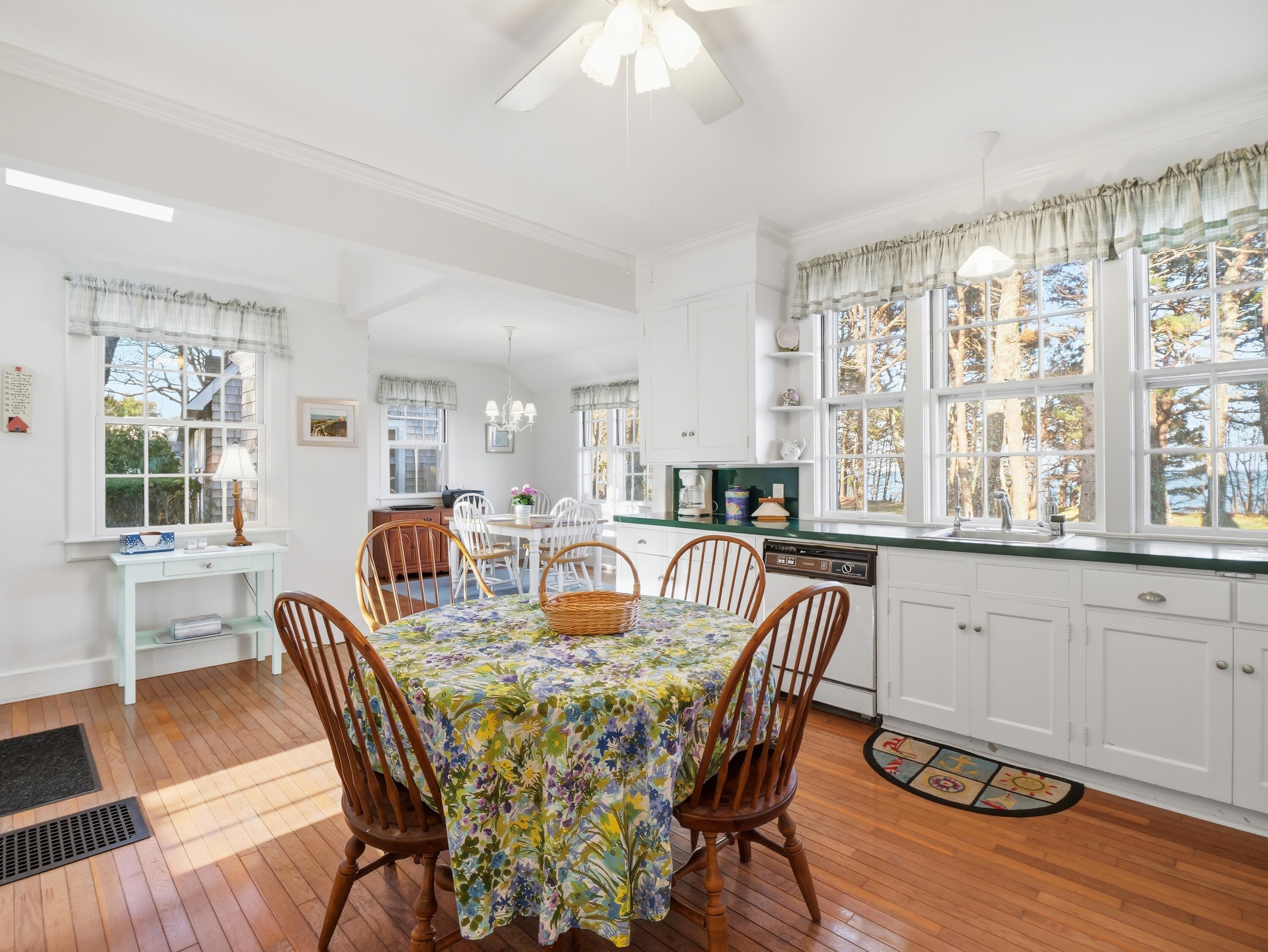 190 Vineyard Road Cotuit, MA 02635 - Photo 14 of 41 a view of a dining room with furniture and wooden floor