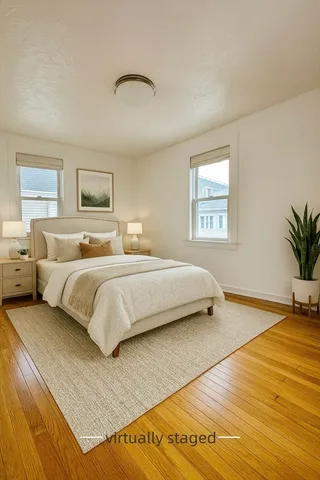 a bedroom with bed and window