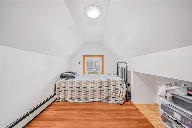 a bedroom with a bed and lamp