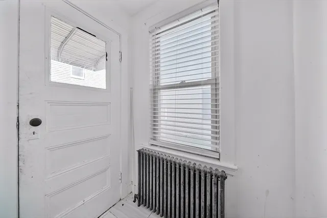 a view of a hallway that has a window in it