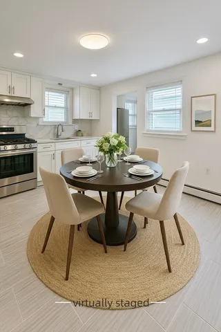 a dining room with furniture and window