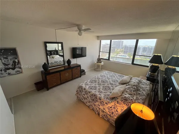 a living room with furniture rug and window