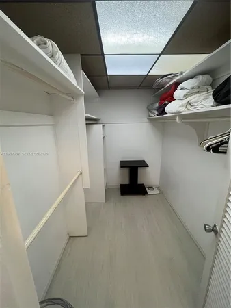 a view of an empty room with racks on the wall