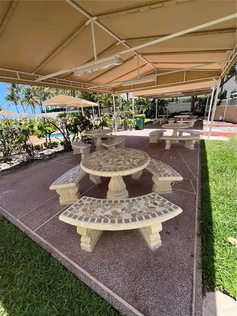 a view of a patio with a table and chairs