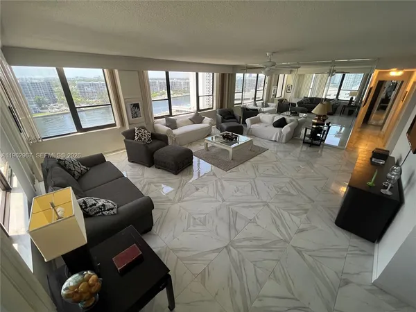 a living room with furniture and a large window