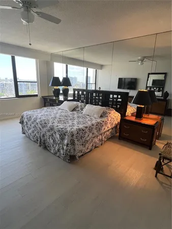 a bed room with bed and window