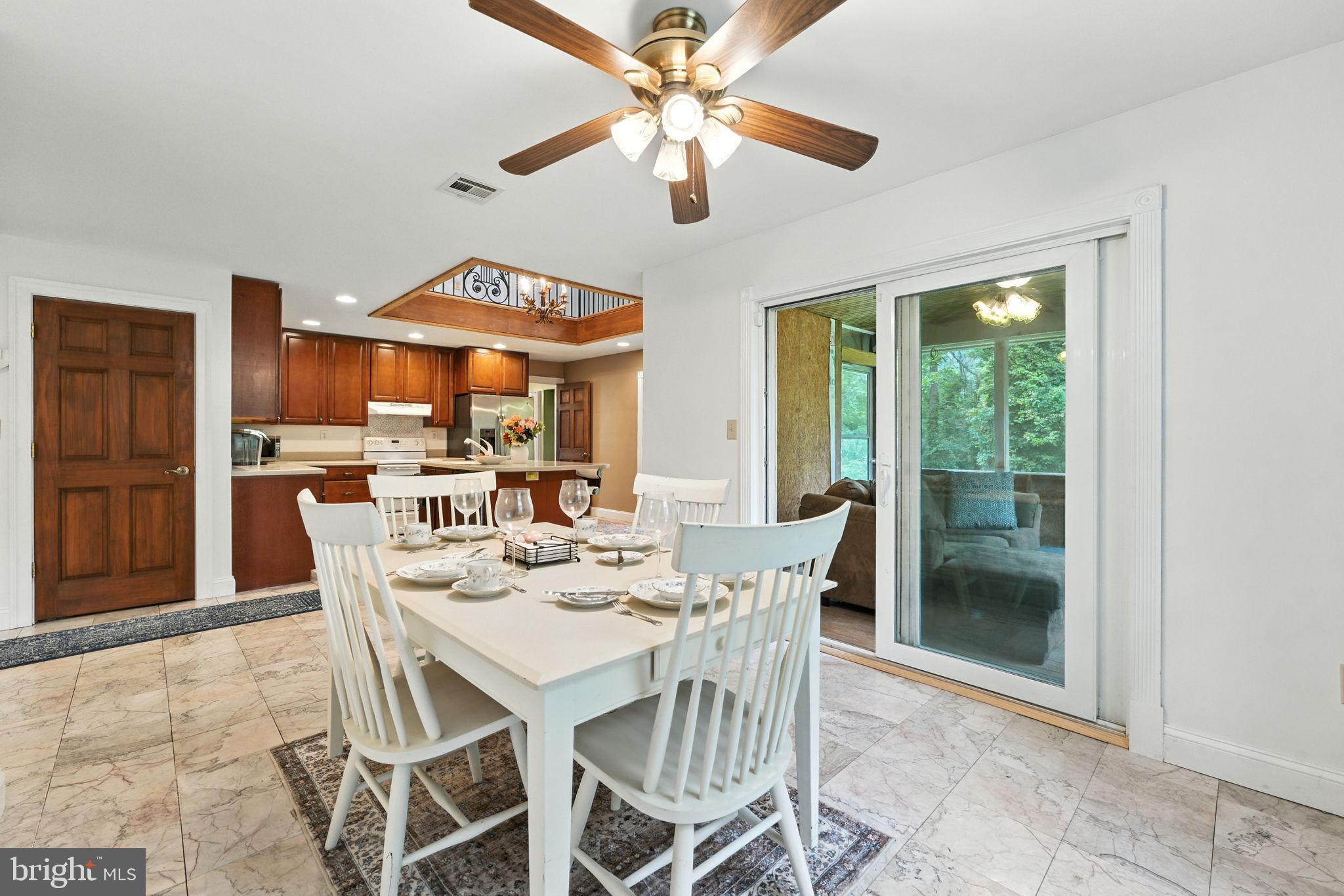 609 Creek Road Kennett Square, PA 19348 - Photo 12 of 39 a view of a dining room with furniture window and outside view