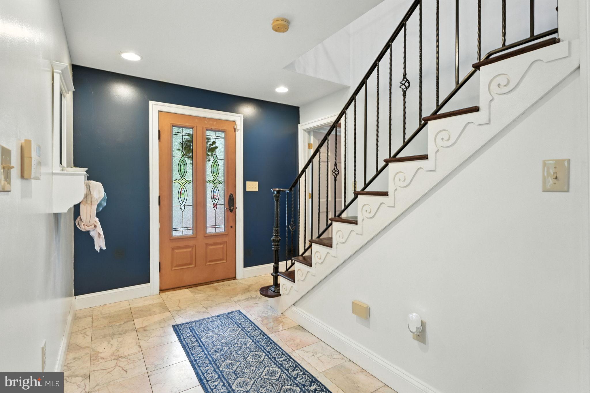 609 Creek Road Kennett Square, PA 19348 - Photo 17 of 39 a view of staircase with white walls and a window
