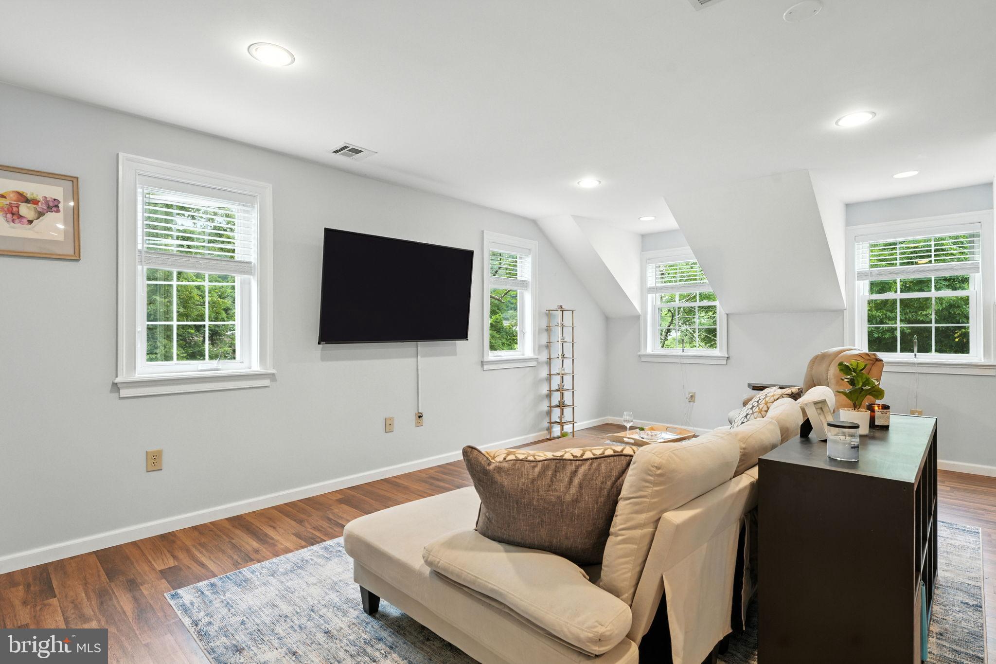 609 Creek Road Kennett Square, PA 19348 - Photo 20 of 39 a living room with furniture and a flat screen tv