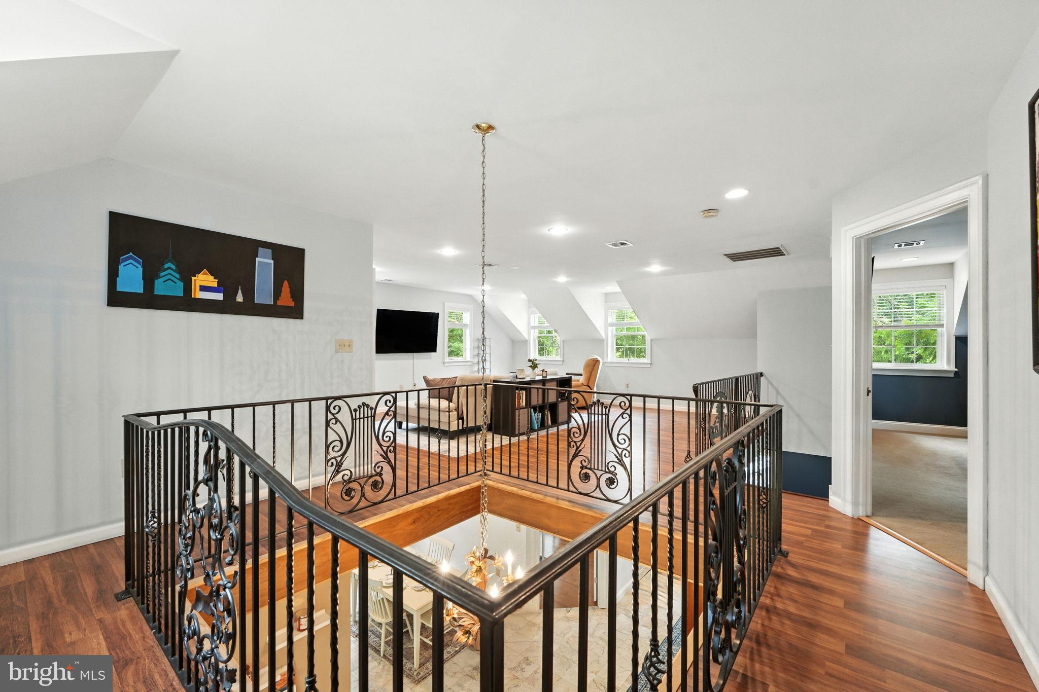609 Creek Road Kennett Square, PA 19348 - Photo 24 of 39 a view of a hallway with seating space and a wooden floor