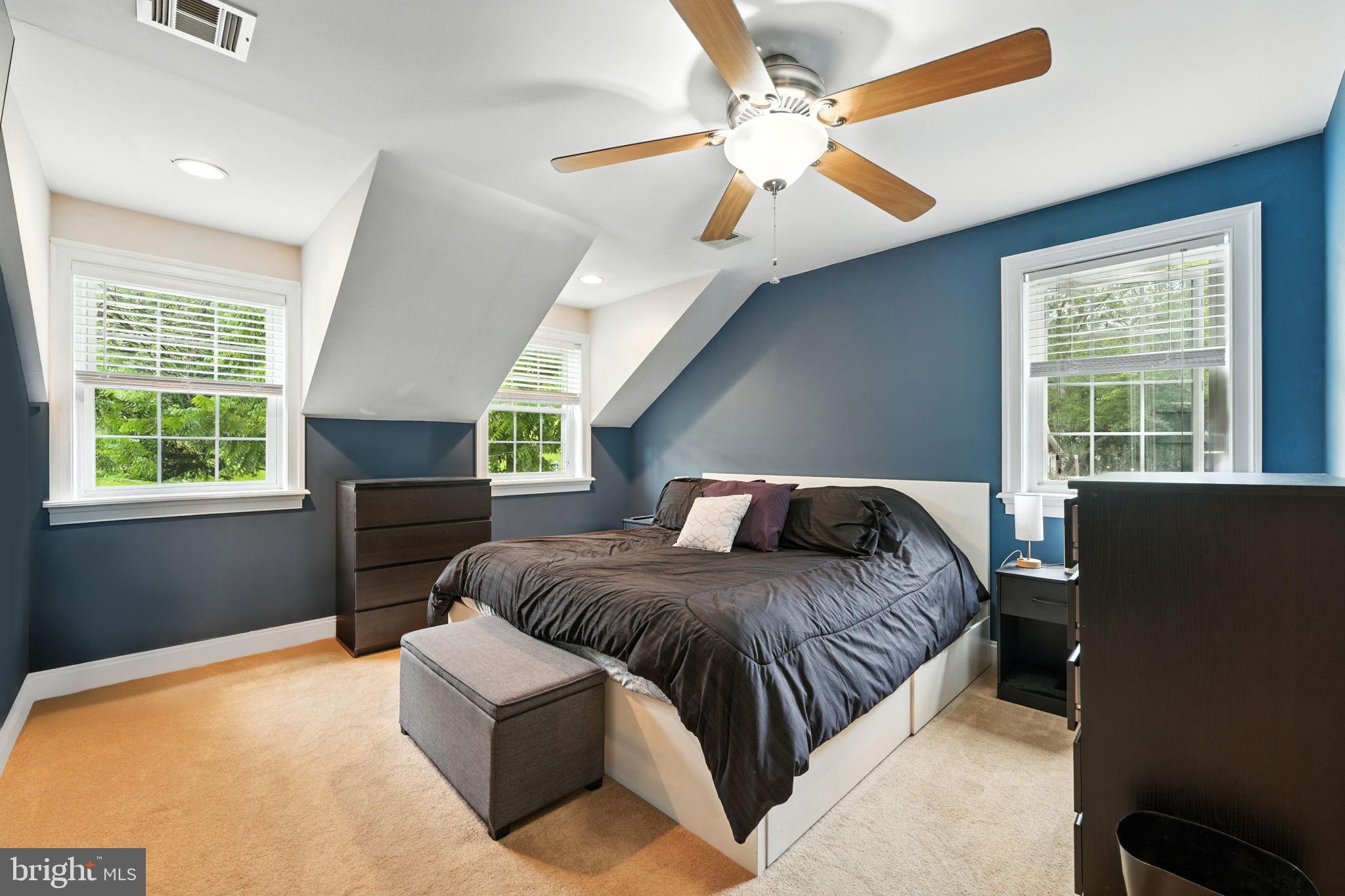 609 Creek Road Kennett Square, PA 19348 - Photo 25 of 39 a bedroom with a large bed couch and a window
