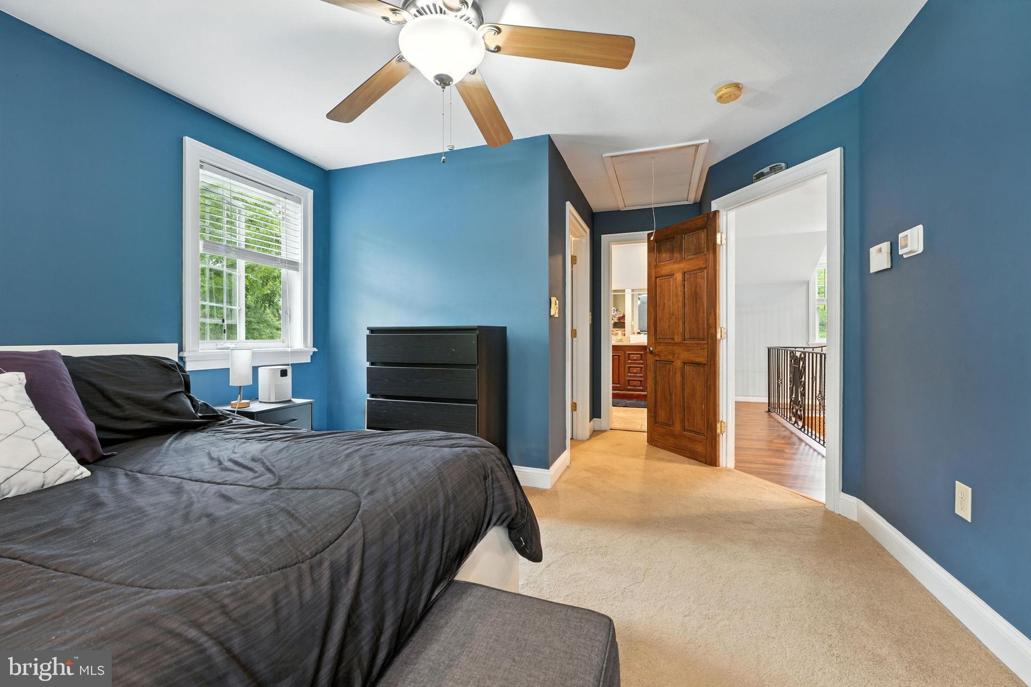 609 Creek Road Kennett Square, PA 19348 - Photo 26 of 39 a bedroom with a bed and wooden floor