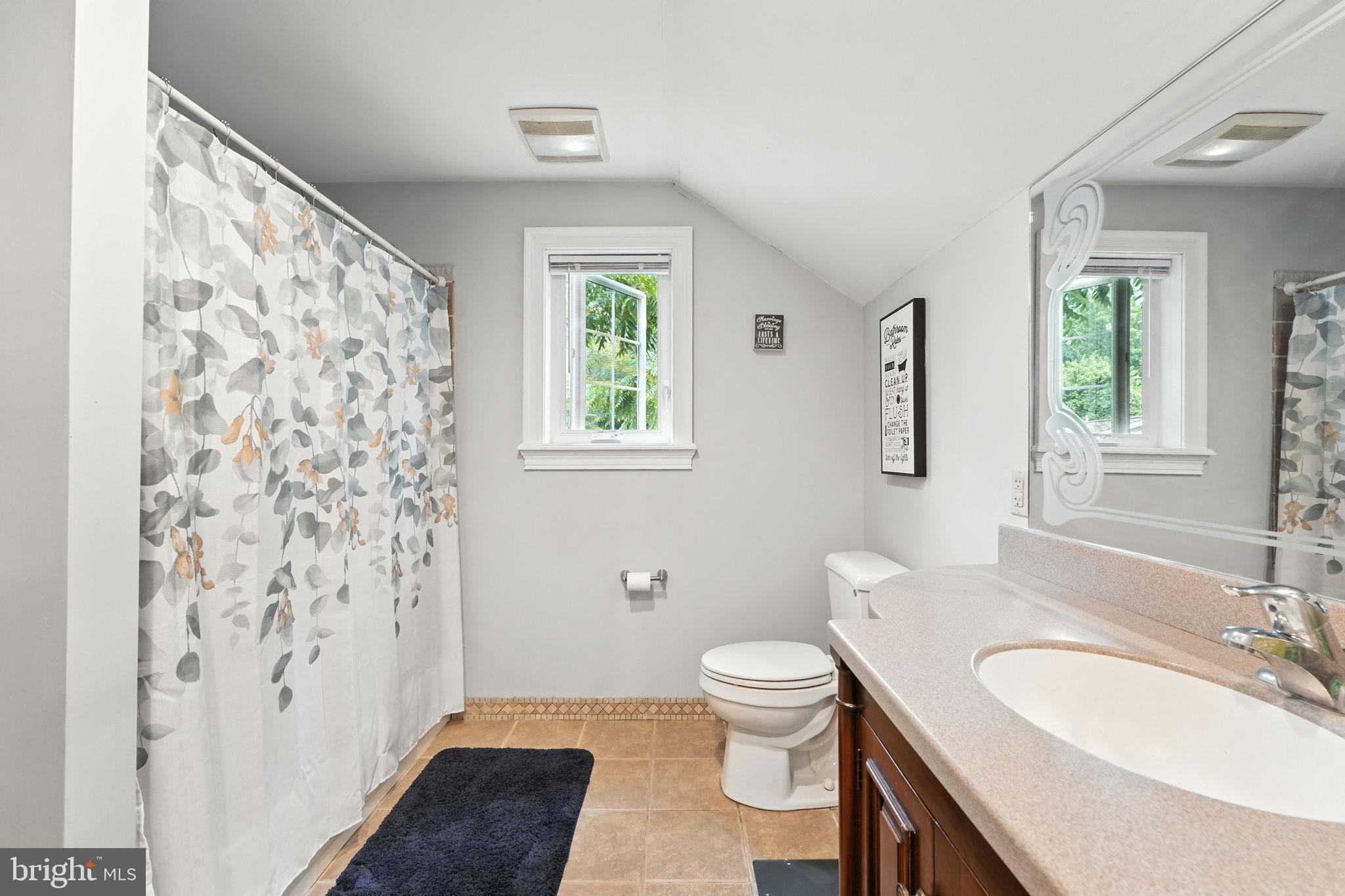 609 Creek Road Kennett Square, PA 19348 - Photo 29 of 39 a bathroom with a toilet a sink and a mirror