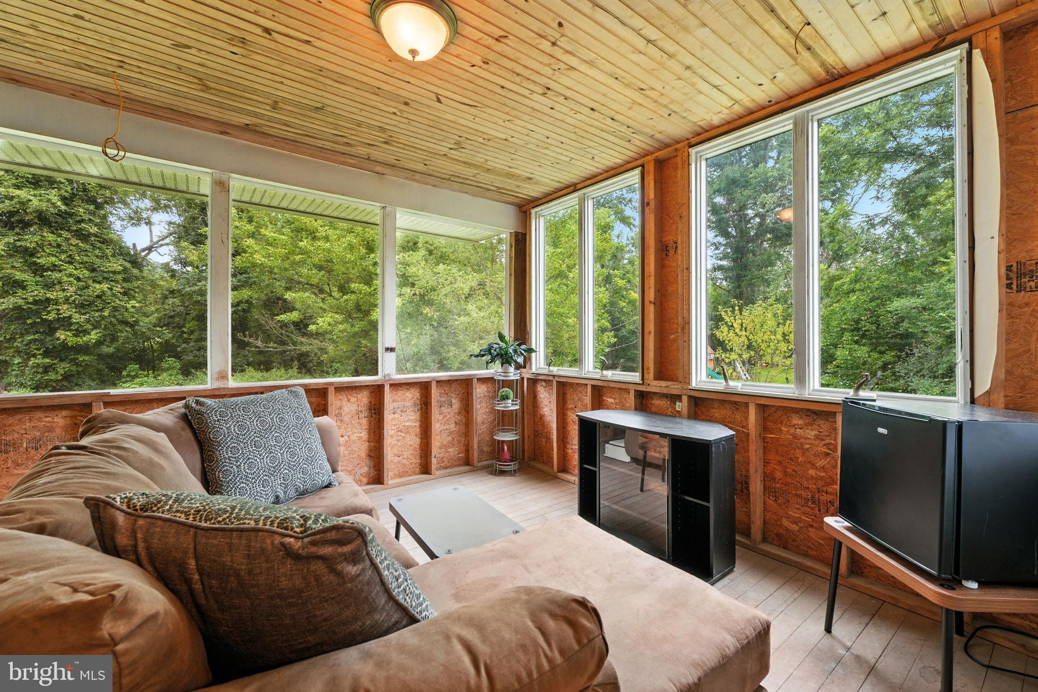 609 Creek Road Kennett Square, PA 19348 - Photo 30 of 39 a living room with furniture and large windows