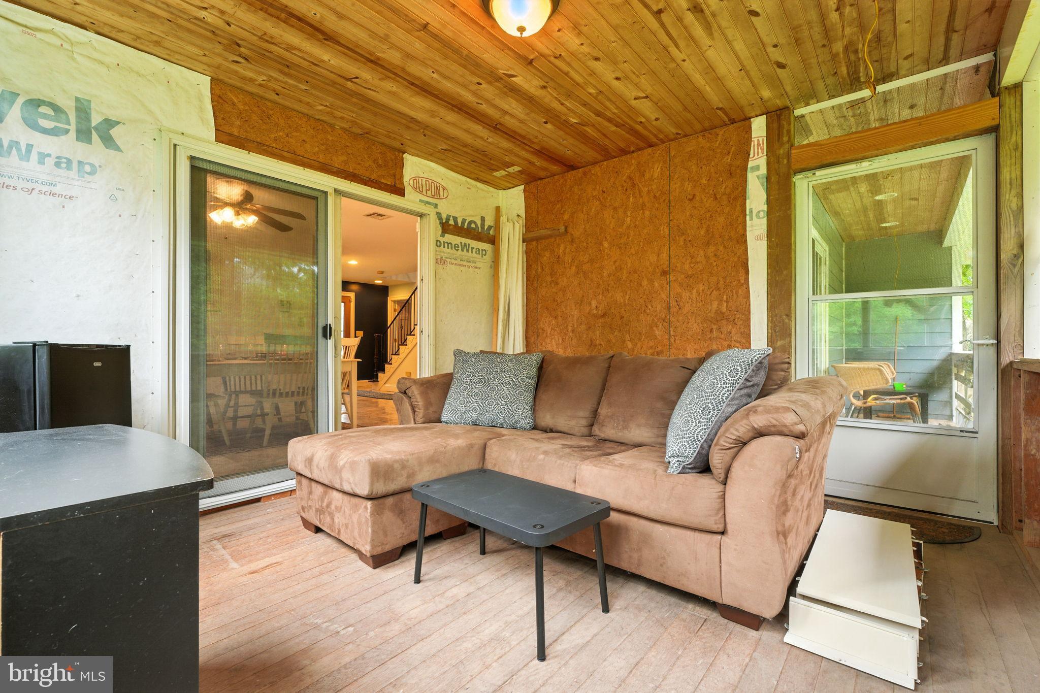 609 Creek Road Kennett Square, PA 19348 - Photo 31 of 39 a living room with furniture and a large window