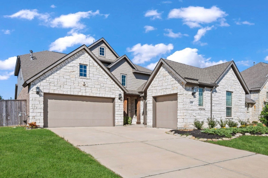 a view of residential house and garage
