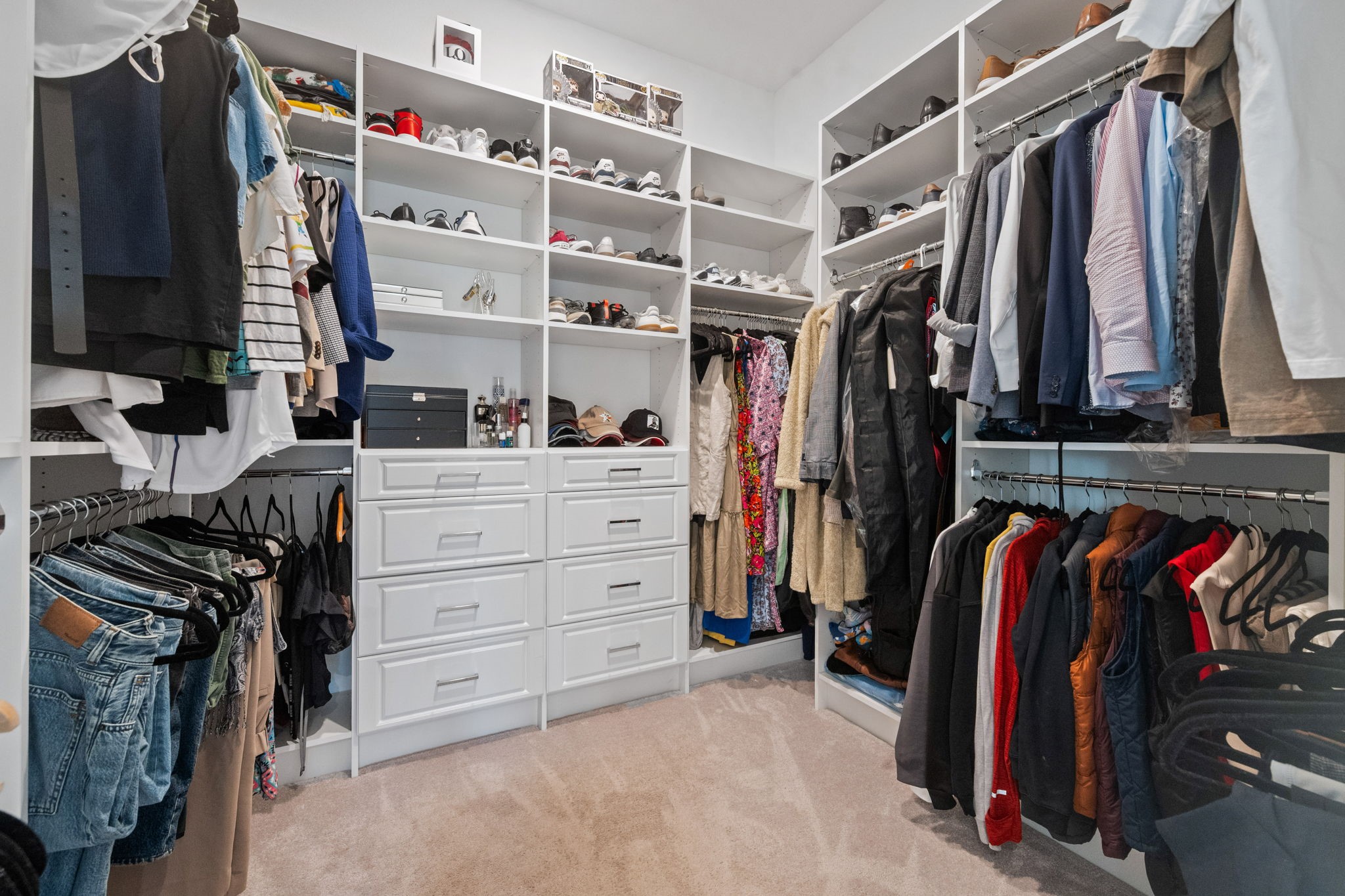 4218 Redford Valley Road Rosharon, TX 77583 - Photo 14 of 36 a view of walk in closet with clothes and shoes