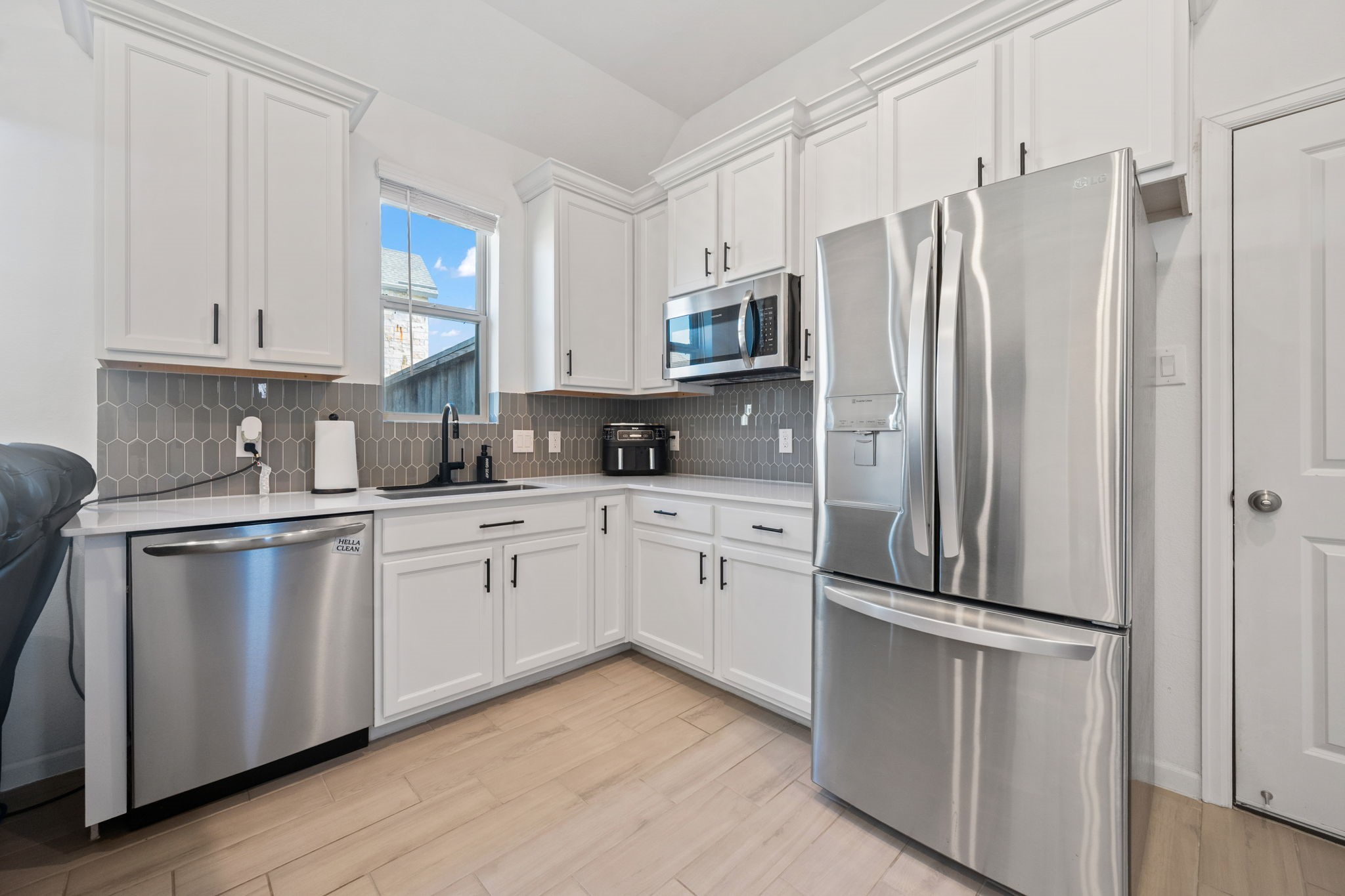 4218 Redford Valley Road Rosharon, TX 77583 - Photo 23 of 36 a kitchen with stainless steel appliances a refrigerator sink and microwave