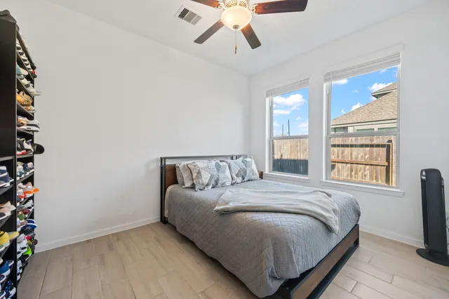 a bedroom with a bed and a window